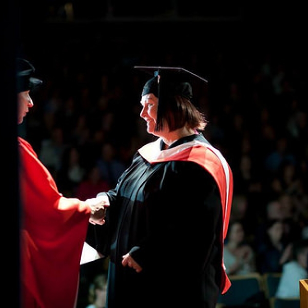 Jacqueline shaking hands with Dean MacKay