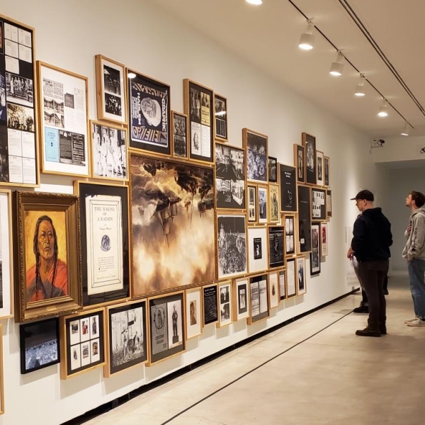 Display of White Man's Burden, with ANTH 335 students viewing a portion.