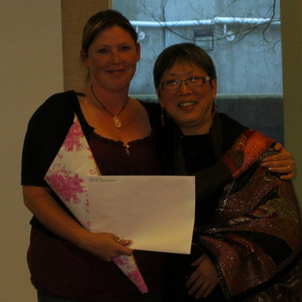 2009 Anthropology Awards Reception Bel is the recipient of the Essex & Kent/Stephen Salem Award; this is the second year of this award. Imogene Lim presents Bel with flowers and award; March 12, 2009.