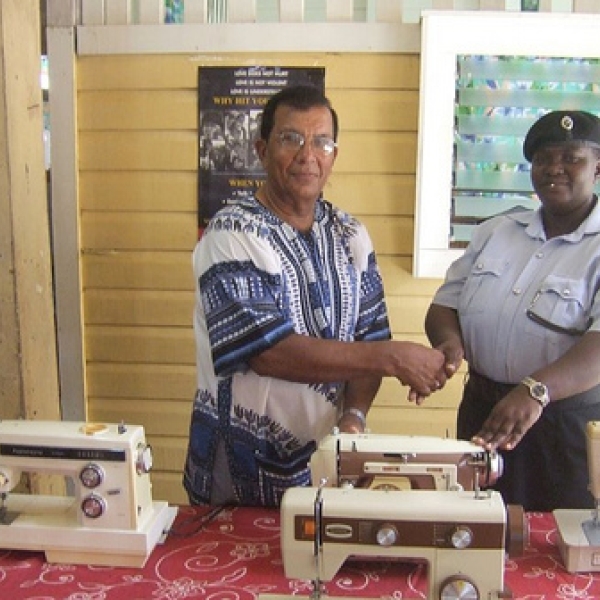 Nanaimo Sewing School Officer Beverly Ogleton of the New Amsterdam receiving from Dr Andra Thakur five sewing machines donated by the Nanaimo Sewing School to the New Amsterdam Prison Service. 