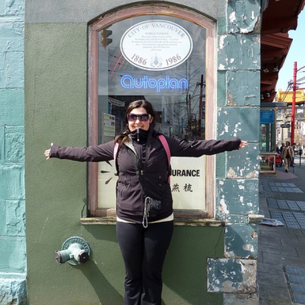 The narrowest building in the world Kairis demonstrating how wide the Sam Kee Building is. 