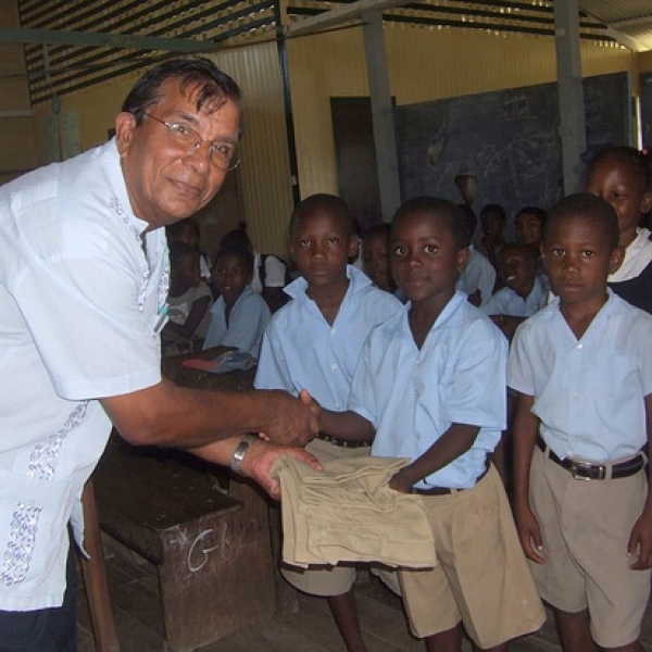 Nanaimo Sewing School Primary school students receiving back-packs, with uniforms included - provided by the Nanaimo Sewing School (Dr Andra Thakur). Donating back-packs to less fortunate students is an annual project of the Corriverton Rotary Club.