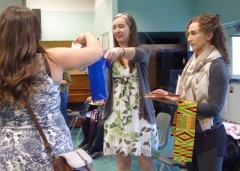 Raffle draw held at the Anthropology Forum 2018; Jessica holding bag with names and Victoria with prizes.