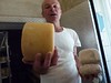 Ulisse shows some of the cheeses that are aging, Podere Il Casale