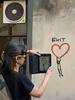 Cheryl documenting Exit-street art